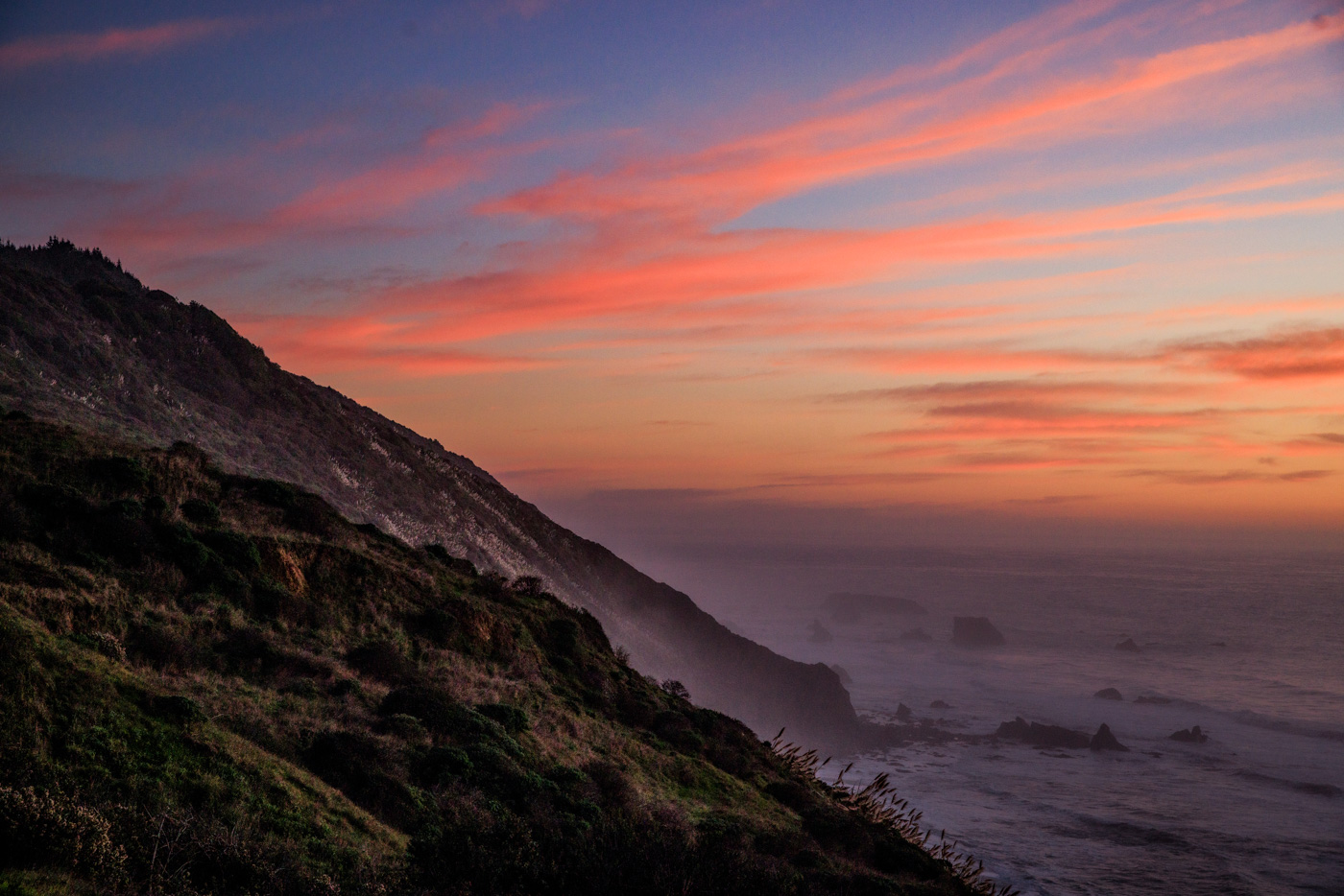 landscape of the rugged coastline vista jutting into the Pacific Ocean at sunset