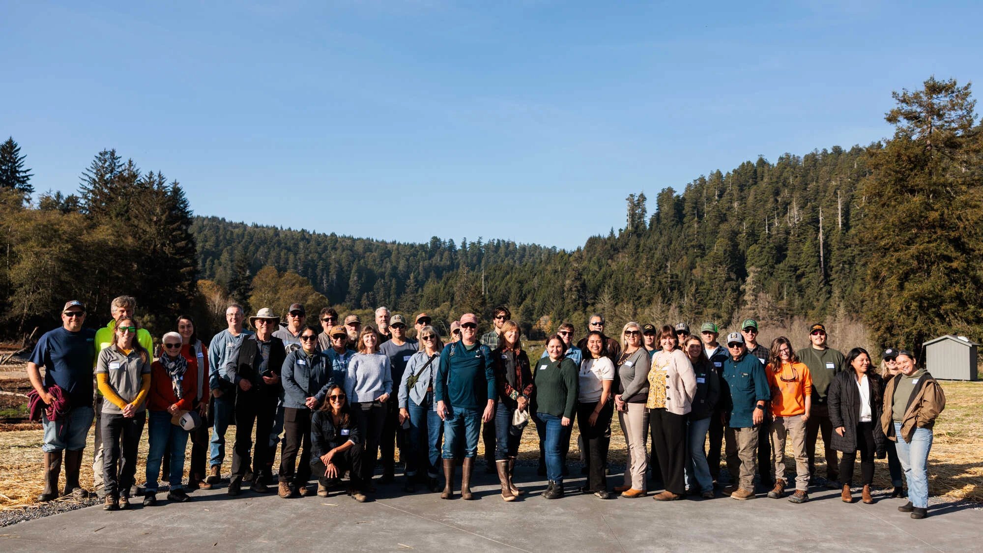 Partners of the 'O Rew Redwoods Gateway restoration project gathered on site for a group photo.