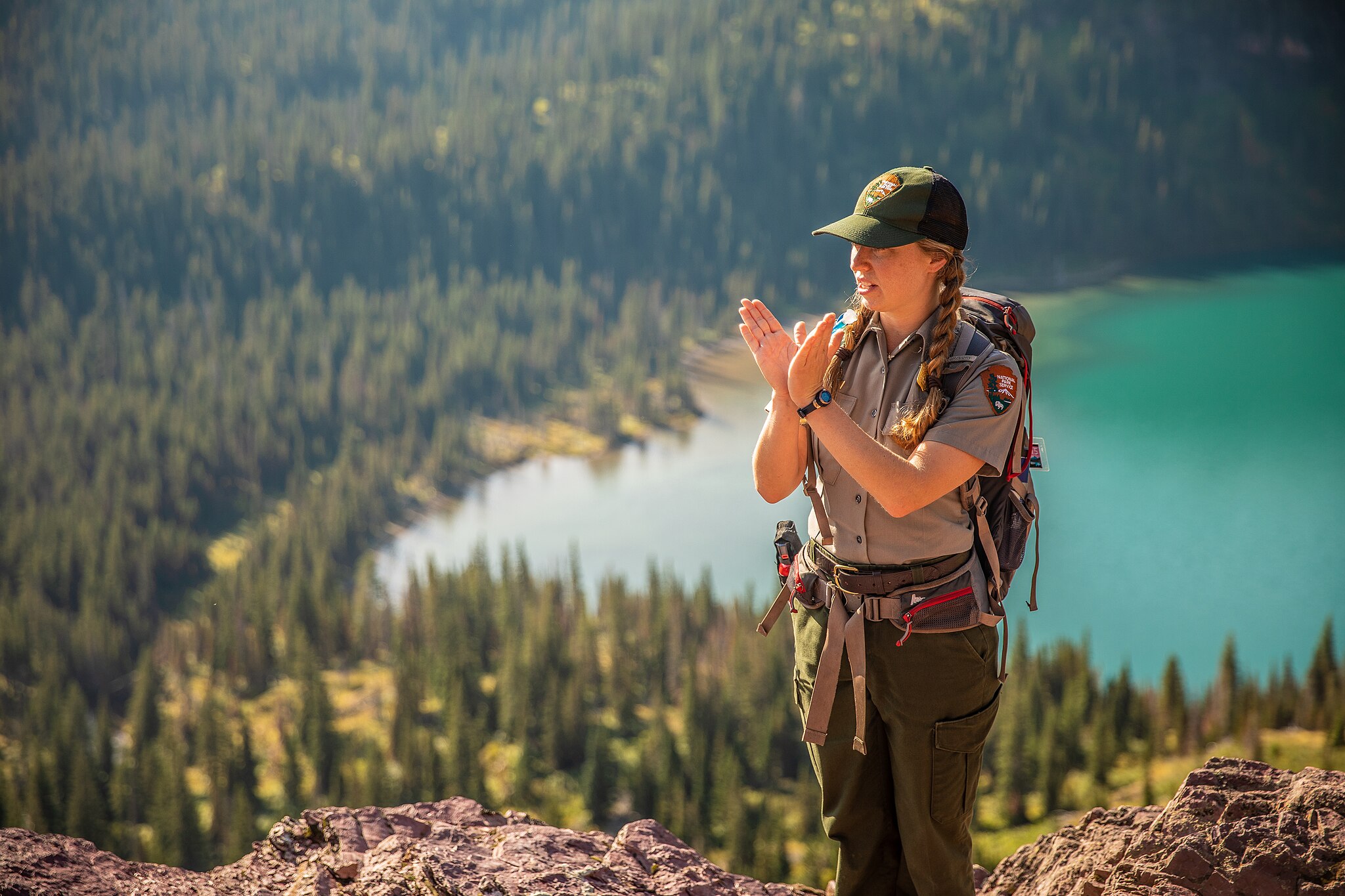 Park Ranger Leading a Hike. GlacierNPS, Public domain, via Wikimedia Commons