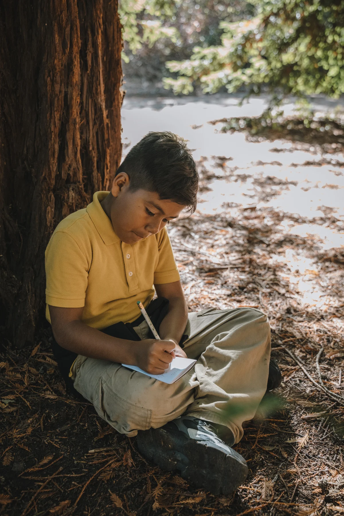 student natural journaling at Roberts Regional park
