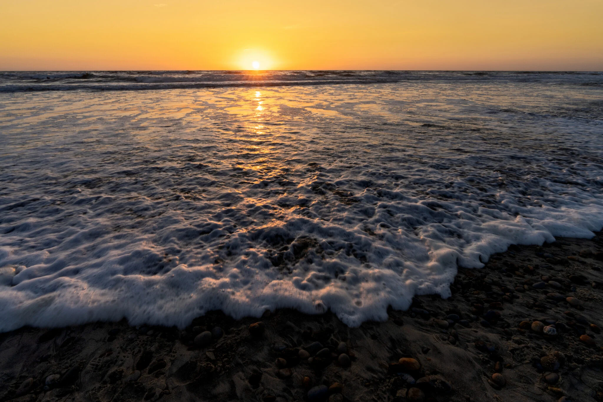 Ocean tide at sunset
