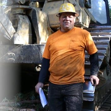 Logger with heavy machinery